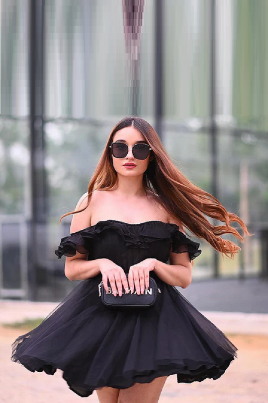 Black onesie ruffled top paired with a tulle skirt